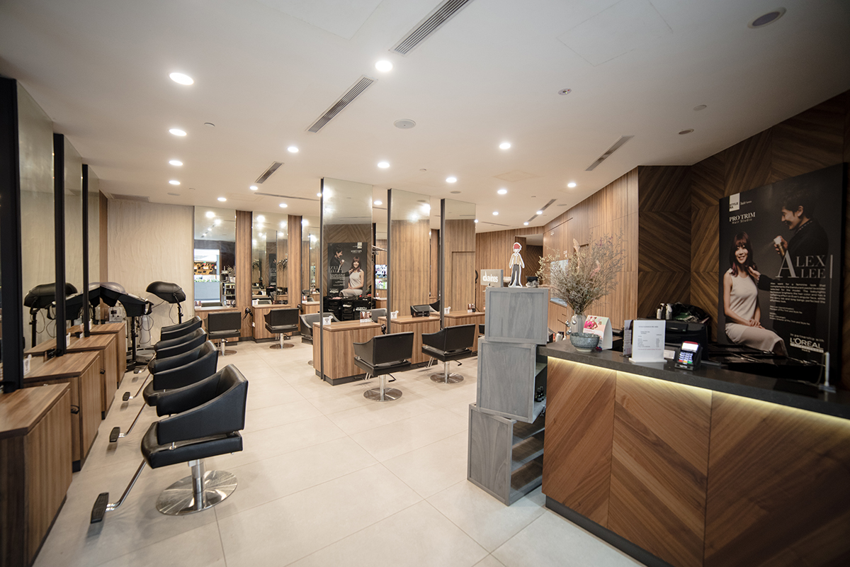 Styling counters and mirrors arranged along the salon wall