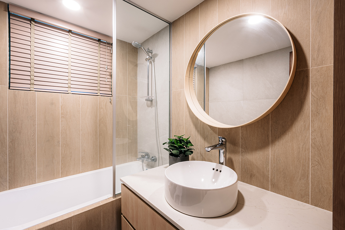 Bathroom finished in muted tones with restrained detailing