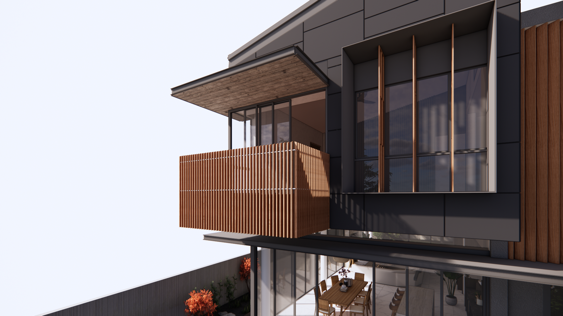 Dining and living area opening through glass walls onto the surrounding garden