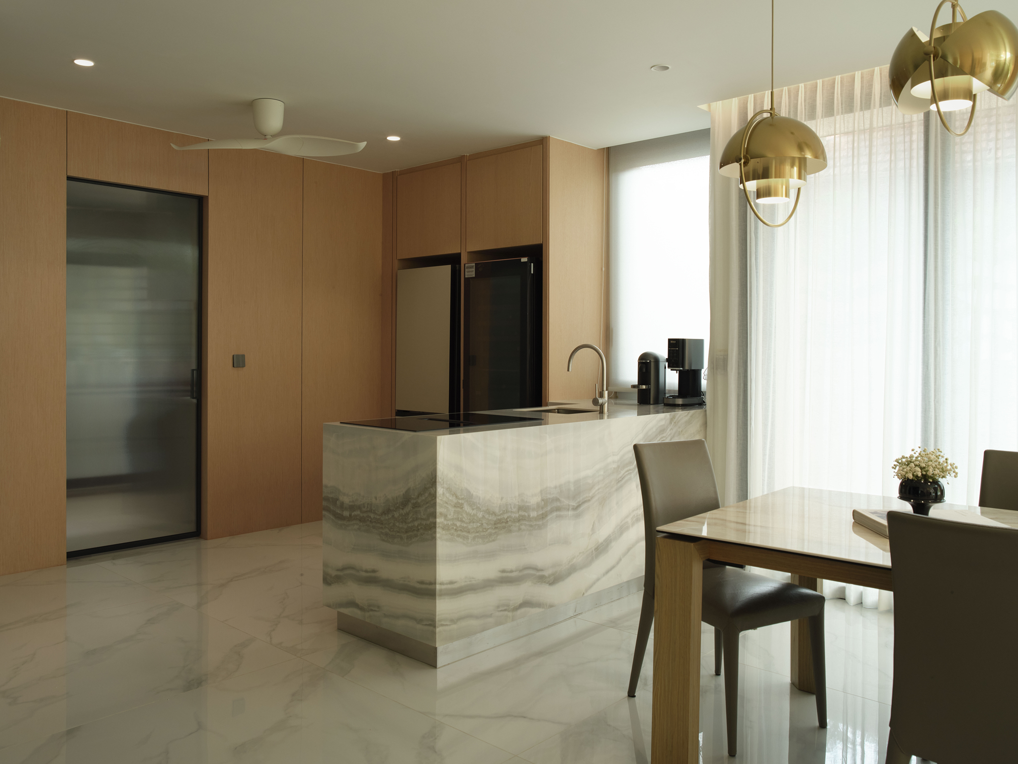Interior detail of the renovated twin house in warm timber and stone