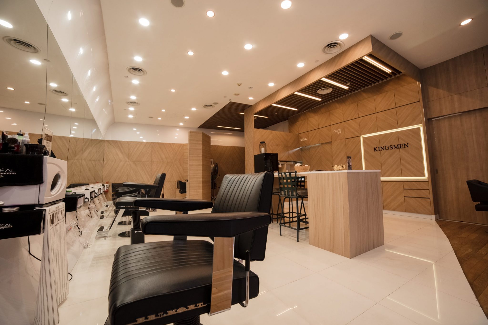 Hair saloon with elegant wooden counter table and wide mirrors